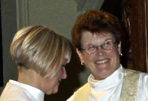 Archdeacon Marion Vincett assists newly installed Archdeacon Lynne Corfield